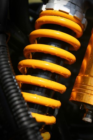 Yellow shock absorber of a quad bikeの写真素材