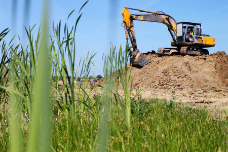 Heavy excavator on stack of earthの写真素材