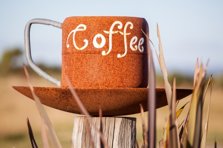 Enormous cup of coffee, concept of high coffee consummationの写真素材