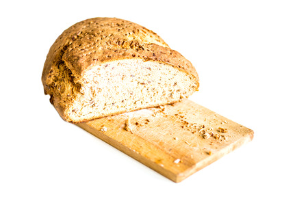 Home made bread on a plank isolated on whiteの写真素材