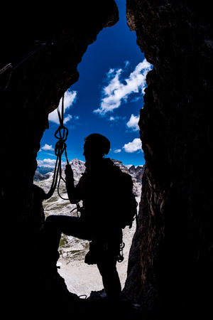 Silhouette of a climber during multi-pitch mountain ascentの写真素材