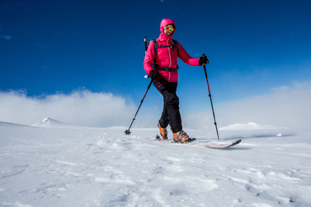 Young woman enjoying backcountry skiingの写真素材