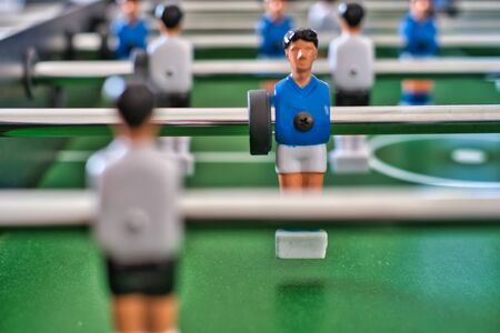 Isolated table fotball figure after it hits the ballの写真素材