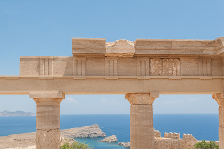 Remains of ancient columns in the Greek Doric Order.  Against blue sky. Greece.の写真素材