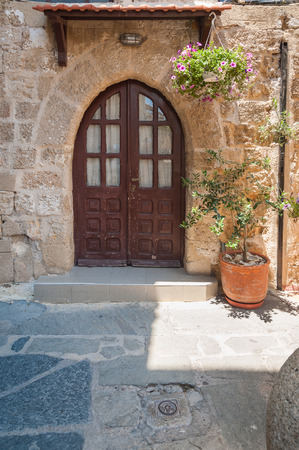 Residential medieval dwelling in historical part of downtown in Rhodes, Old Town, Island of Rhodes. Greece. Europe.の写真素材