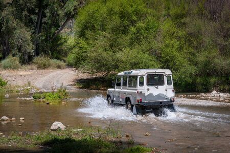Rural Andalucia. Spain. 06/10/2016. Riverbed crossing in 4x4 terrain vehicle.の写真素材