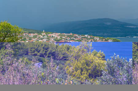Remains of shipwreck washed ashore spoiling Adratic Sea coastline.の写真素材