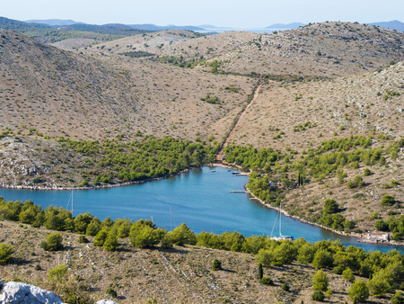 Bay with anchoring yachts, in the middle of Kornati national park islands in summer Croatiaの写真素材