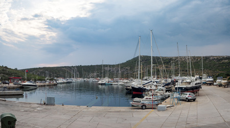 Anchoring Yachts at a port and Croatian Landscapeのeditorial素材