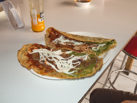 Puebla, Mexico, South America - January 2018: [Woman cooking memelas, tacos, quesadillas, Mexican street food]のeditorial素材