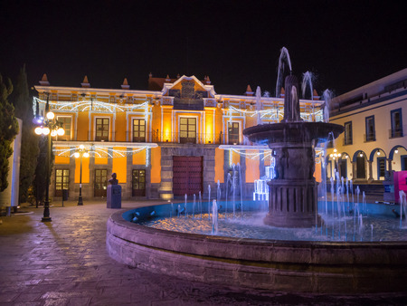 Puebla, Mexico, South America - January 2018: [Town of Puebla at night, street and church decorated with lights]のeditorial素材