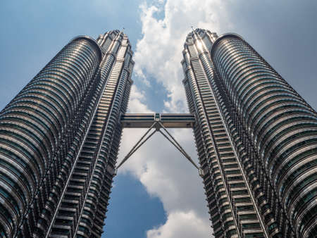 Kuala Lumpur, Malaysia : Petronas Twin Towers with bridge, modern architecture and capital city panorama tourist destinationのeditorial素材