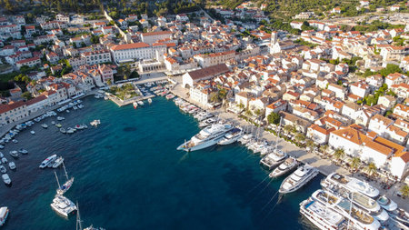 Streets of historic and tourist town of Hvar with fort, port and yacht marine, Croatian island...