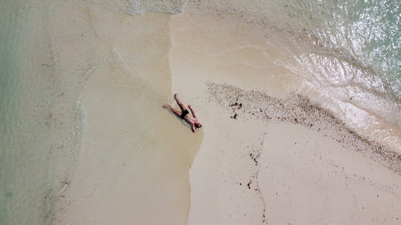 Maldives resort island drone aerial view, Indian ocean atoll nature beach and palm forest, leisure tourist luxury vacationの写真素材