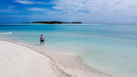 Maldives resort island drone aerial view, Indian ocean atoll nature beach and palm forest, leisure tourist luxury vacationの写真素材