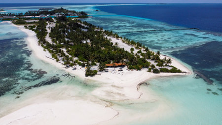 Maldives resort island drone aerial view, Indian ocean atoll nature beach and palm forest, leisure tourist luxury vacationの写真素材