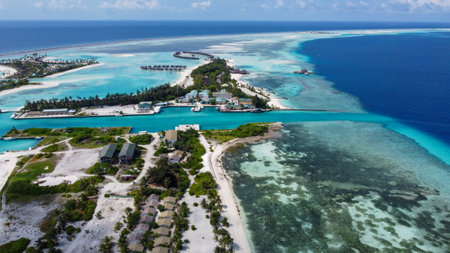 Maldives resort island drone aerial view, Indian ocean atoll nature beach and palm forest, leisure tourist luxury vacationの写真素材