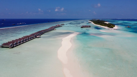 Maldives resort island drone aerial view, Indian ocean atoll nature beach and palm forest, leisure tourist luxury vacationの写真素材