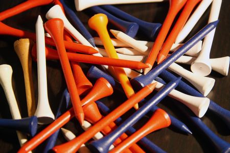 Colored golf tees in a pile の写真素材