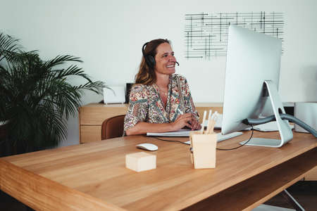 woman working from home, telecommuting, teleworking with modern and design environmentの写真素材