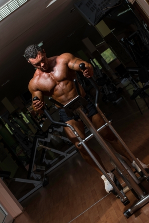 male bodybuilder using the elliptical machineの写真素材