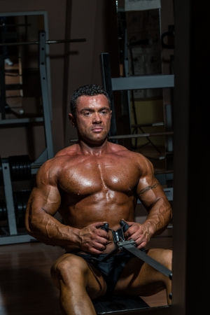 male body builder doing heavy weight exercise for backの写真素材