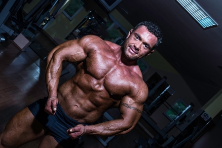 muscular bodybuilder showing his upper bodyの写真素材