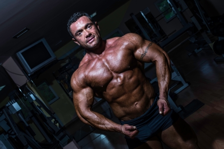 muscular bodybuilder showing his upper bodyの写真素材