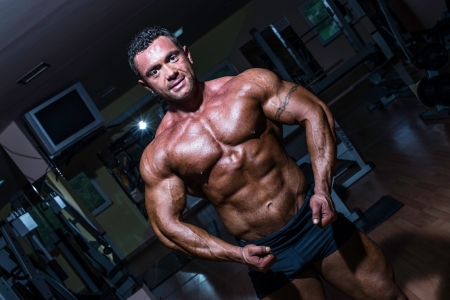 muscular bodybuilder showing his upper bodyの写真素材