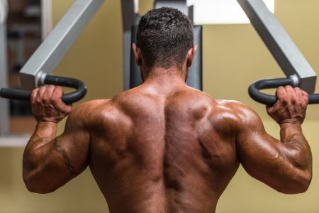 shirtless body builder doing military press for shoulderの写真素材