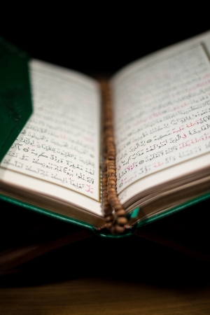 pages of holy koran and rosary at the bookの写真素材