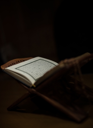 pages of holy koran and rosary at the bookの写真素材