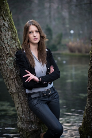 young woman posing at the treeの写真素材