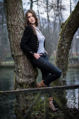 young woman posing at the treeの写真素材