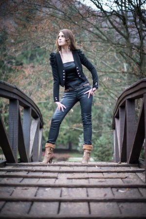 young woman standing at the bridgeの写真素材