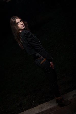 young woman looking behind her shoulderの写真素材