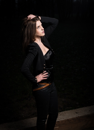 young woman posing and looking upの写真素材