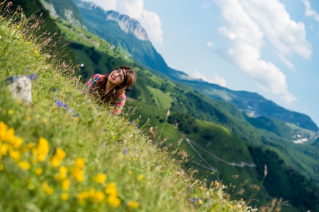 beautiful woman lying on the grassの写真素材
