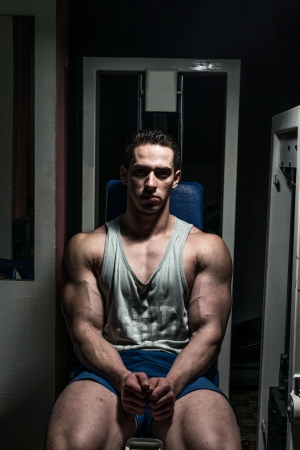 young bodybuilder resting at the benchの写真素材