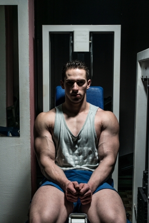 young bodybuilder resting at the benchの写真素材
