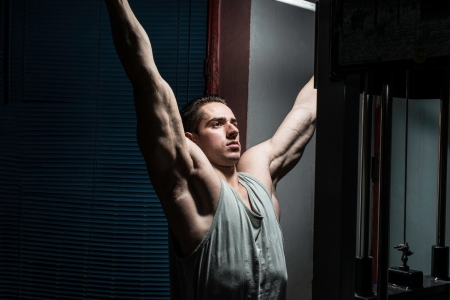 young body builder doing heavy weight exercise for backの写真素材