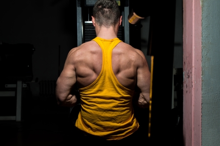 male bodybuilder flexing his backの写真素材