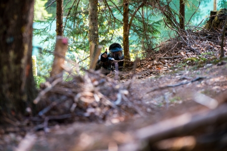 Paintball player showing on fingerの写真素材