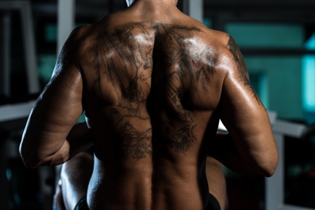 bodybuilder flexing his backの写真素材