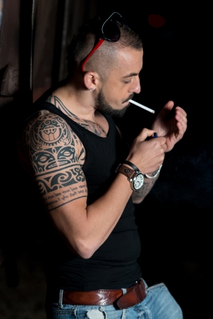 Young Man Firing Up A Cigarの写真素材