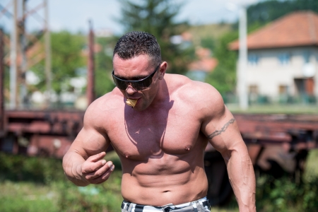 Muscular Man Eating Pancakesの写真素材