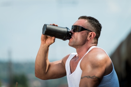 Bodybuilder Resting And Drinking Protein Shakeの写真素材