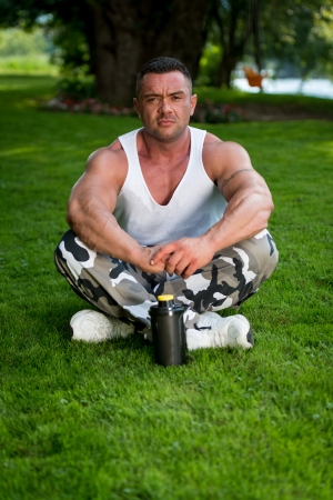 Bodybuilder Resting In Natureの写真素材