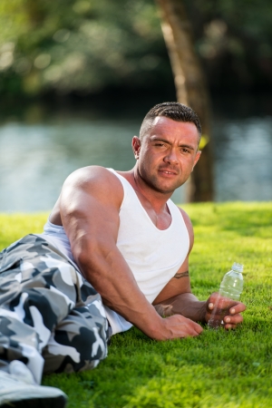 Bodybuilder Holding Water Bottleの写真素材