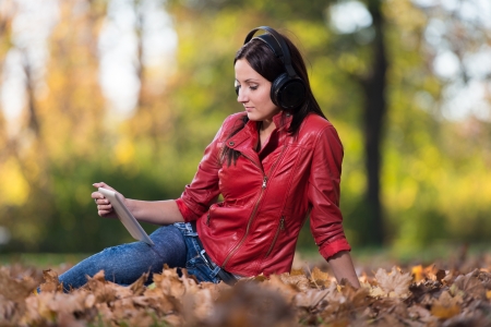Young Woman Listening To Music In Natureの写真素材